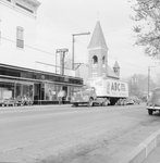 Walter's Restaurant, outside view, with an ABC Dog Food truck driving in front. by William Garber