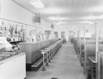 Inside of Walter's Restaurant, with both the counter and opposite booth tables pictured. by William Garber