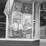 Marston's Home Appliance Store, view of two men pouring drinks in the window display. by William Garber