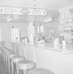 Inside of a diner, view of the counter and menu. by William Garber