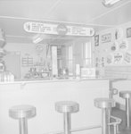 Inside of a diner, view of separate menu and counter. by William Garber