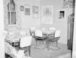 Inside of a diner or restaurant, view of two corner tables. by William Garber