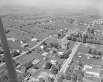 A number of large buildings, probably of the Eastern Mennonite University campus. Harrisonburg, Va. by William Garber