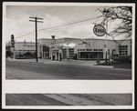 Moyers Motor Company, view from the street with a "Grand Opening" banner hanging in the front by William Garber