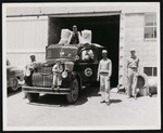 Five men and one small child posing with a Heinz Nu-Way Feeds truck by William Garber