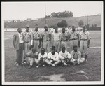 African American baseball team from Elkton, posing on a baseball field with other players in the background by William Garber