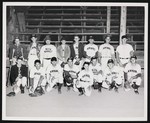 New Market baseball team, probably the New Market Rebels, posing in front of the fan stands by William Garber