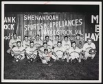Quicksburg baseball team (probably of the Valley Twin County or Rockingham County Leagues), posing in front of a fence that is advertising Shenandoah Sports and Appliances in Woodstock, Va. by William Garber
