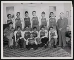 The Timberville Hatchery baseball team posing inside of a home or other building by William Garber