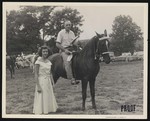 Broadway Horse Show, a man posing on a horse with a ribbon in his hand, and a woman standing next to him by William Garber