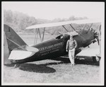 A man posing next to a small airplane that has "(Tyler) Flight Service, Massapequa Park, N.Y., Insect Control" painted on the side of it by William Garber
