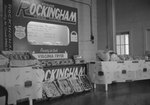 A "Genuine Rockingham Virginia Poultry" display, set up for a fair or other kind of show/presentation. Sponsored by Rockingham Plants in Broadway, Va., and advertising "Ready to Cook Virginia Fryer". by William Garber