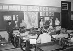 Broadway School, five young boys and girls giving a presentation to a classroom full of their peers. by William Garber
