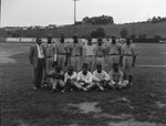 Team photo of an African-American baseball team playing for Elkton, Va., baseball field in the background by William Garber