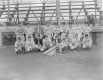 Team photo of the Grottoes Cardinals (probably of the Valley Twin County League or the Rockingham County League), men's baseball team, in front of the stands of a baseball field by William Garber