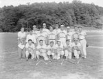 Team photo of the Romney men's baseball team, taken on the edge of a baseball field by William Garber