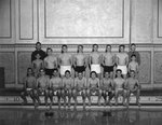 A men's swim team sitting and standing on the edge of an indoor pool by William Garber
