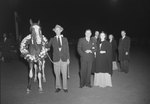Timberville Horse Show, a number of individuals standing next to a horse with a wreath of flowers around its neck by William Garber