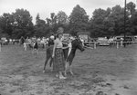 Broadway Horse Show, a woman leading a pony, which a young girl is riding by William Garber