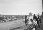 A horse race, with spectators on either side of the track by William Garber