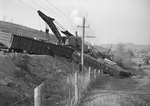 Train wreck, train cars full of logs that had tumbled off of the track by William Garber