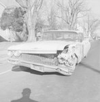 Front view of a car with a badly damaged front end by William Garber