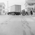Rear view of the a tractor-trailer that has been in an accident, with skid marks pictured on the street by William Garber
